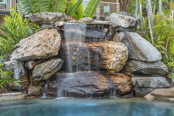 Outdoor pool, pool loungers -  Hotel Tropiq (Cairns North)