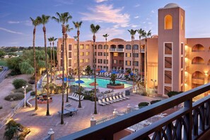 A hotel with a swimming pool surrounded by palm trees and lounge chairs. - Scottsdale Marriott at McDowell Mountains (Scottsdale)