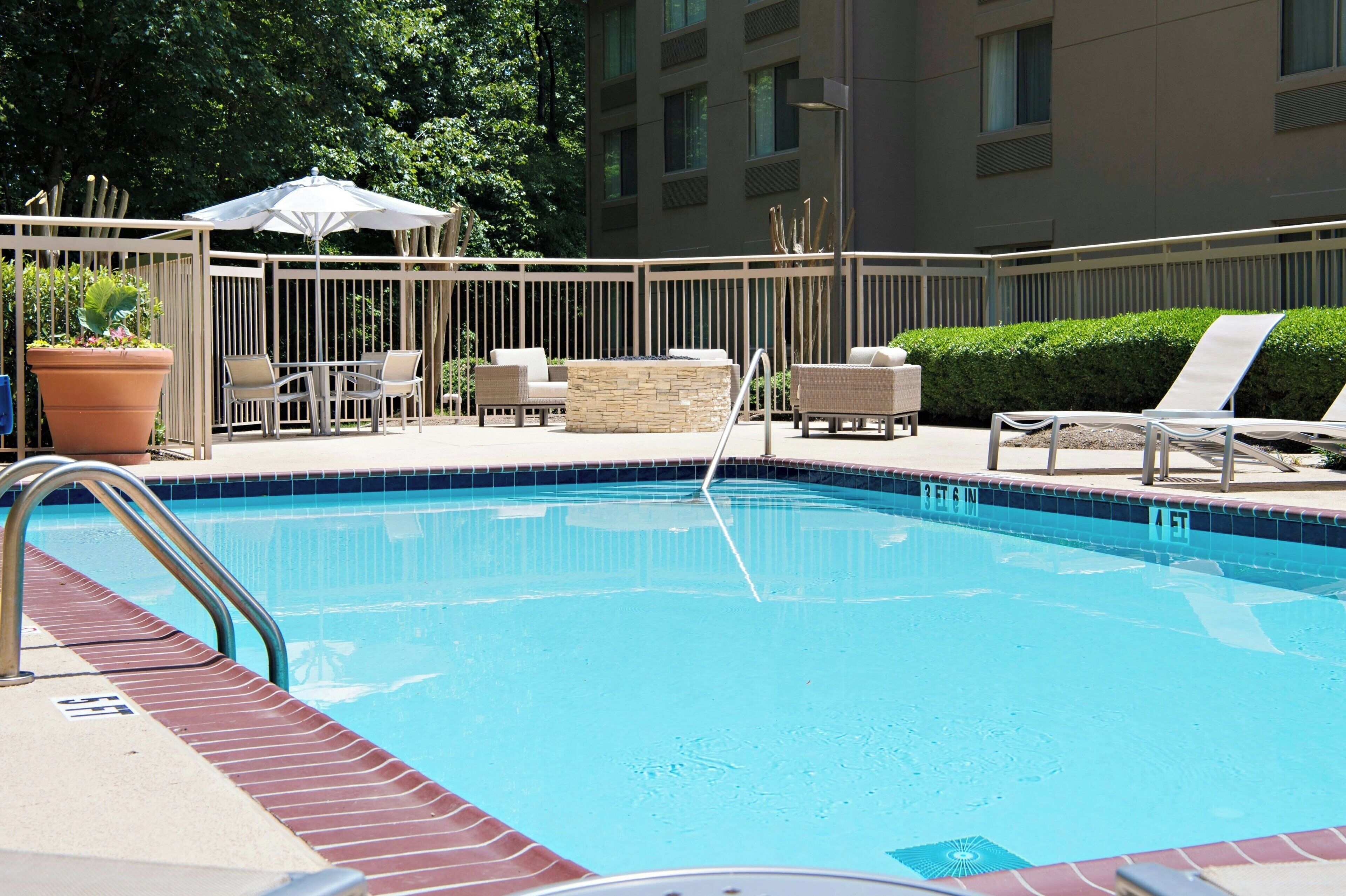 seasonal outdoor pool, open 9:00 am to 9:00 pm, pool umbrellas