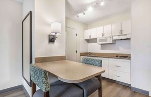 Full-size fridge, microwave, stovetop, coffee/tea maker