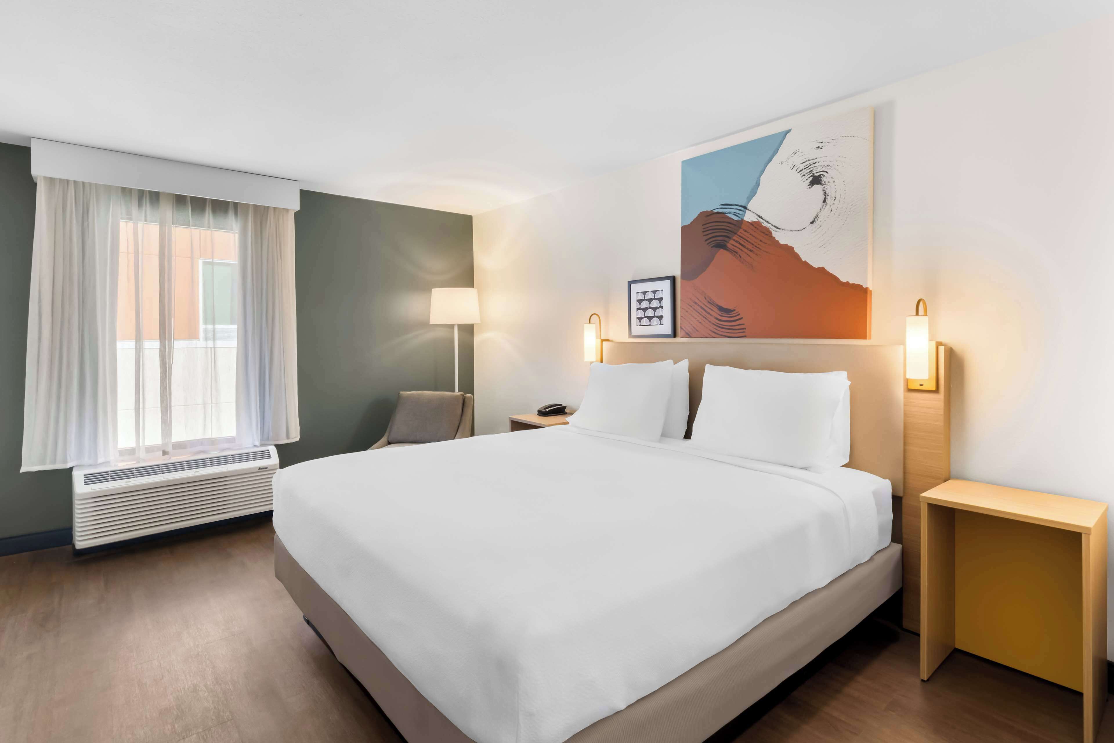 desk, laptop workspace, blackout curtains, iron/ironing board