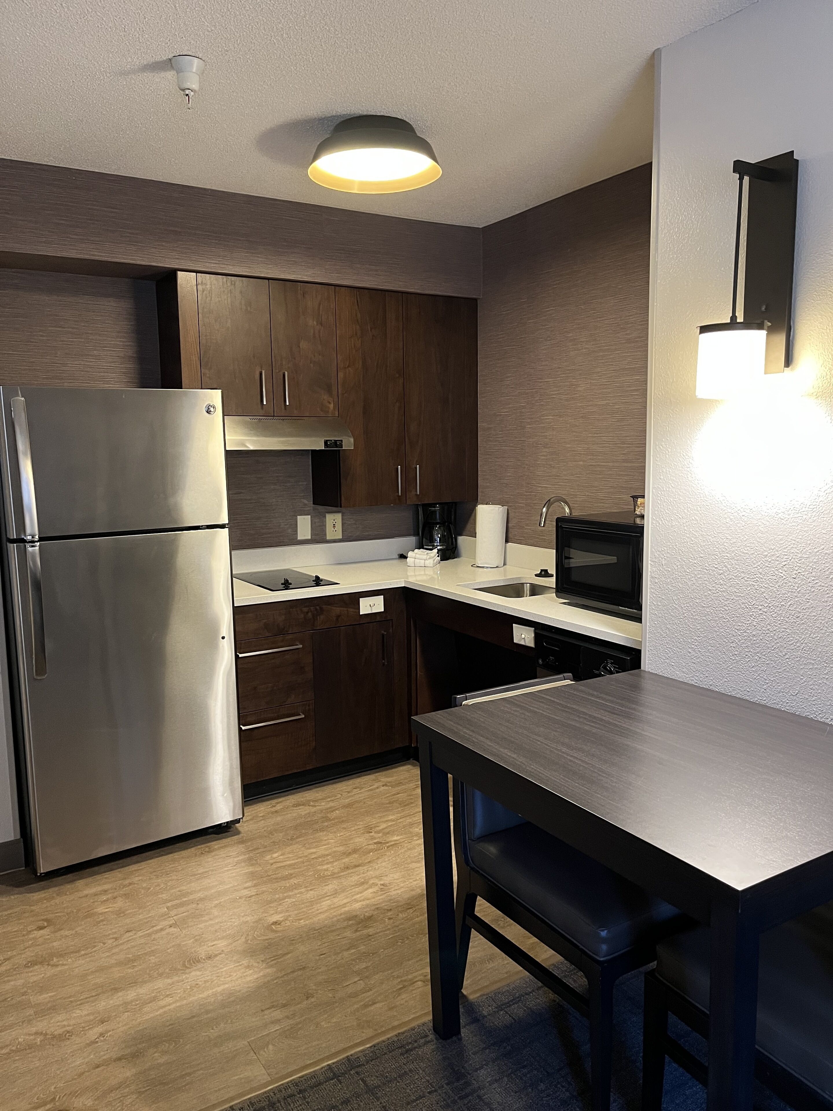 studio suite, 1 queen bed with sofa bed, accessible, fireplace | private kitchen | fridge, microwave, coffee/tea maker, cookware/dishes/utensils