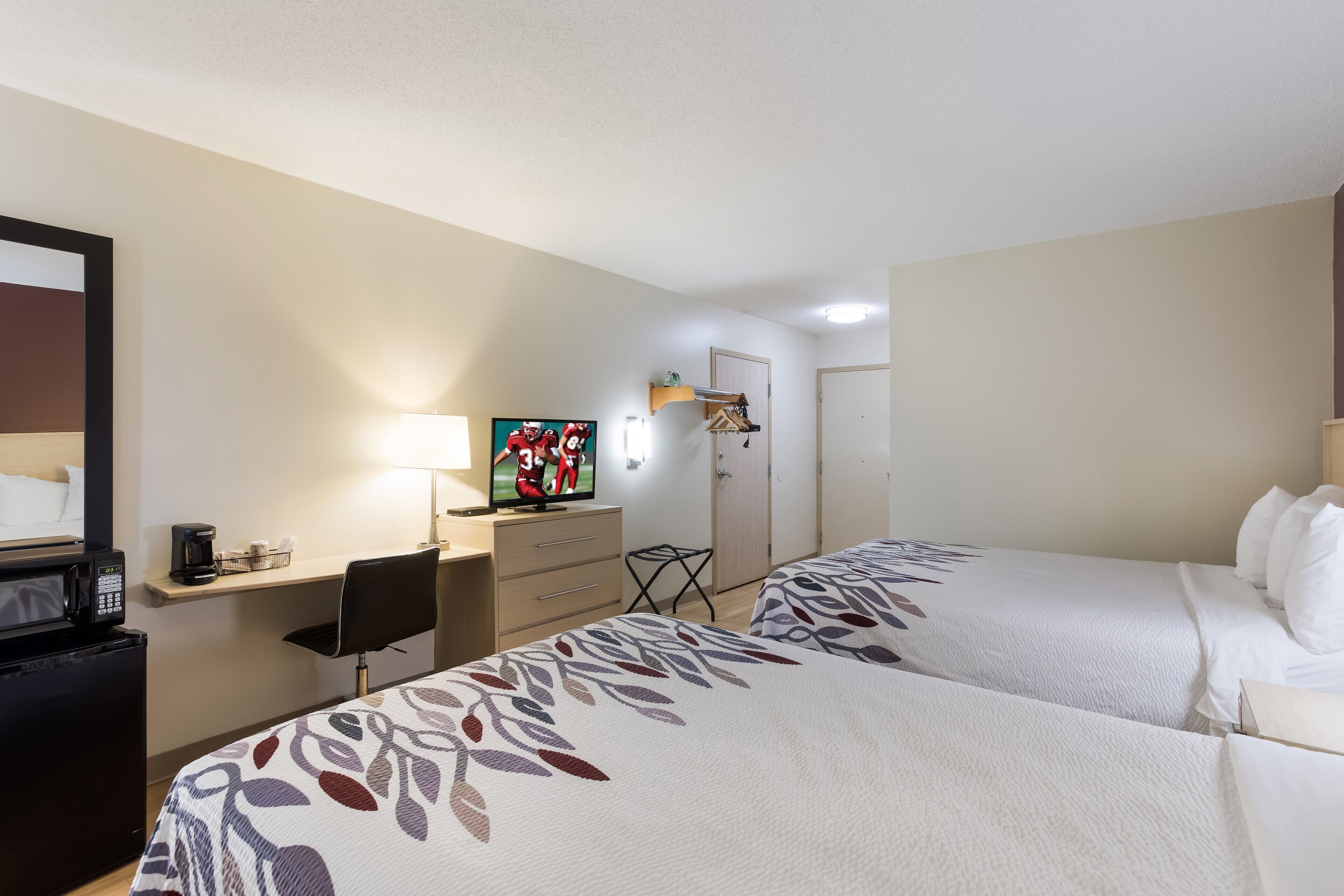 room | desk, blackout curtains, soundproofing, iron/ironing board