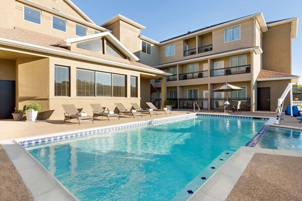Outdoor pool, open 7 AM to 10 PM, sun loungers