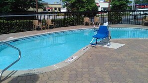 Outdoor pool, open 6:00 AM to 10:00 PM, pool loungers