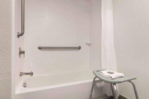 Premium bedding, desk, laptop workspace, blackout drapes