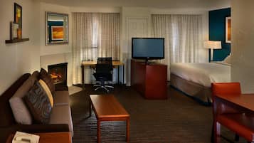 Premium bedding, desk, laptop workspace, blackout drapes