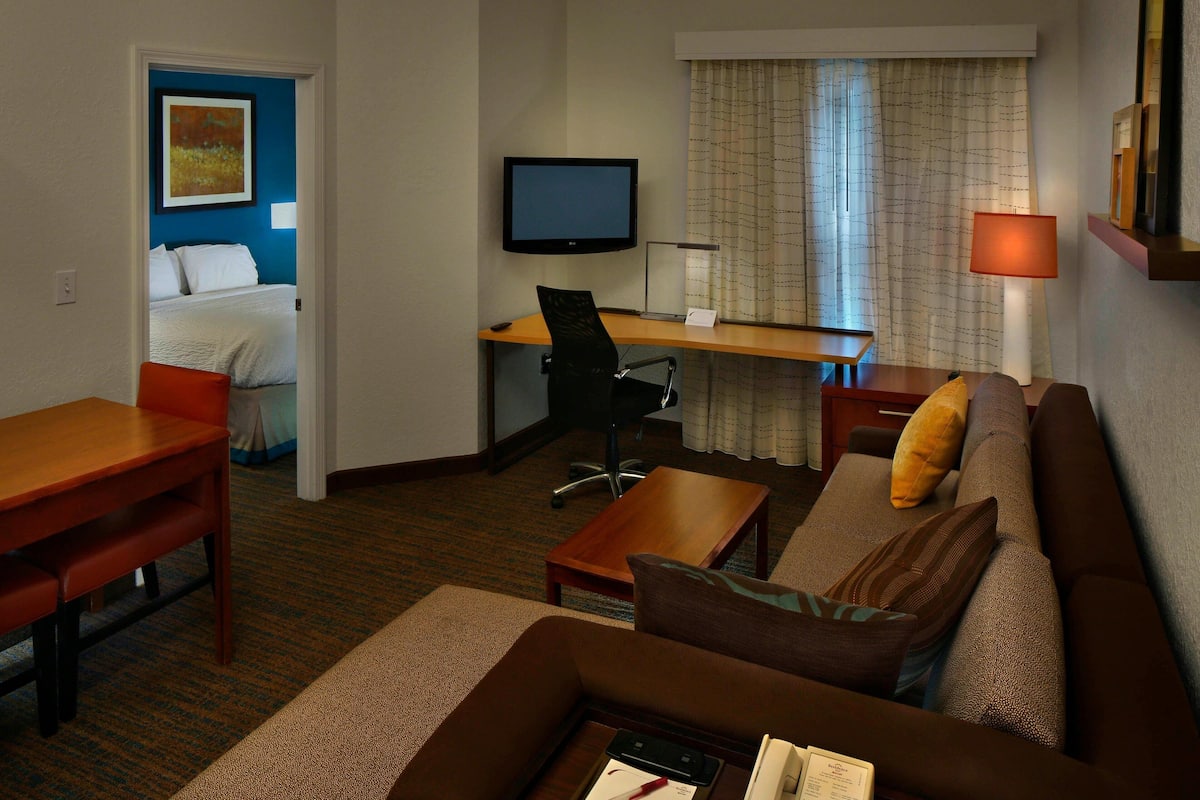 Premium bedding, desk, laptop workspace, blackout drapes
