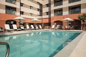 Outdoor pool, open 6 AM to 11 PM, pool umbrellas, pool loungers