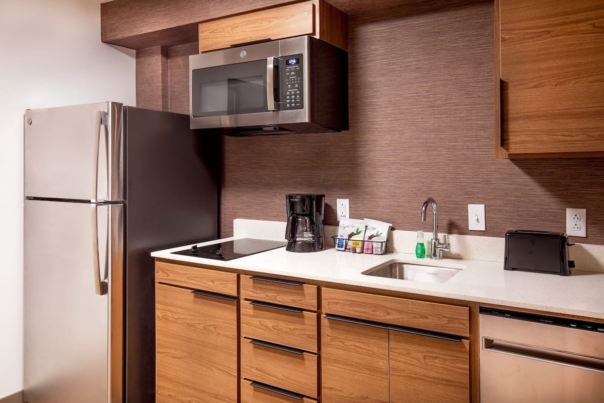 full-sized fridge, microwave, stovetop, dishwasher