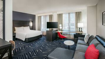 Premium bedding, desk, laptop workspace, blackout curtains