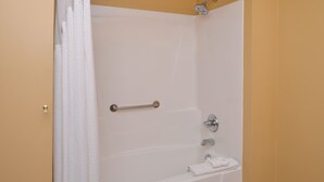A bathroom with a bathtub, a shower, and a towel rack. - Country Inn & Suites by Radisson, Benton Harbor-St. Joseph, MI (Benton Harbor)