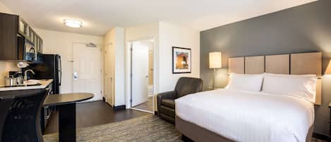 Premium bedding, desk, laptop workspace, blackout drapes