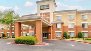 A hotel with a sign reading "Extended Stay America" and a number "6500" on the entrance. - Extended Stay America Suites Memphis Germantown (Memphis)