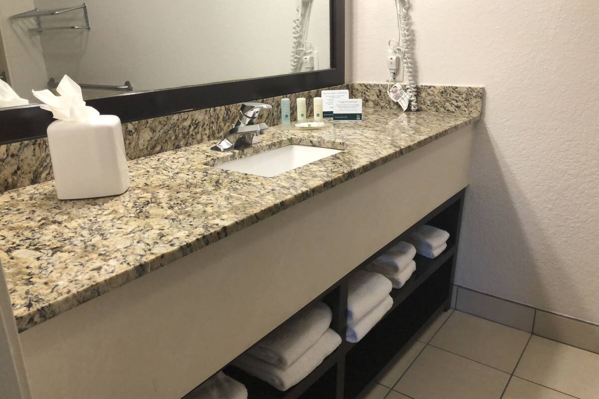 eco-friendly toiletries, hair dryer, towels