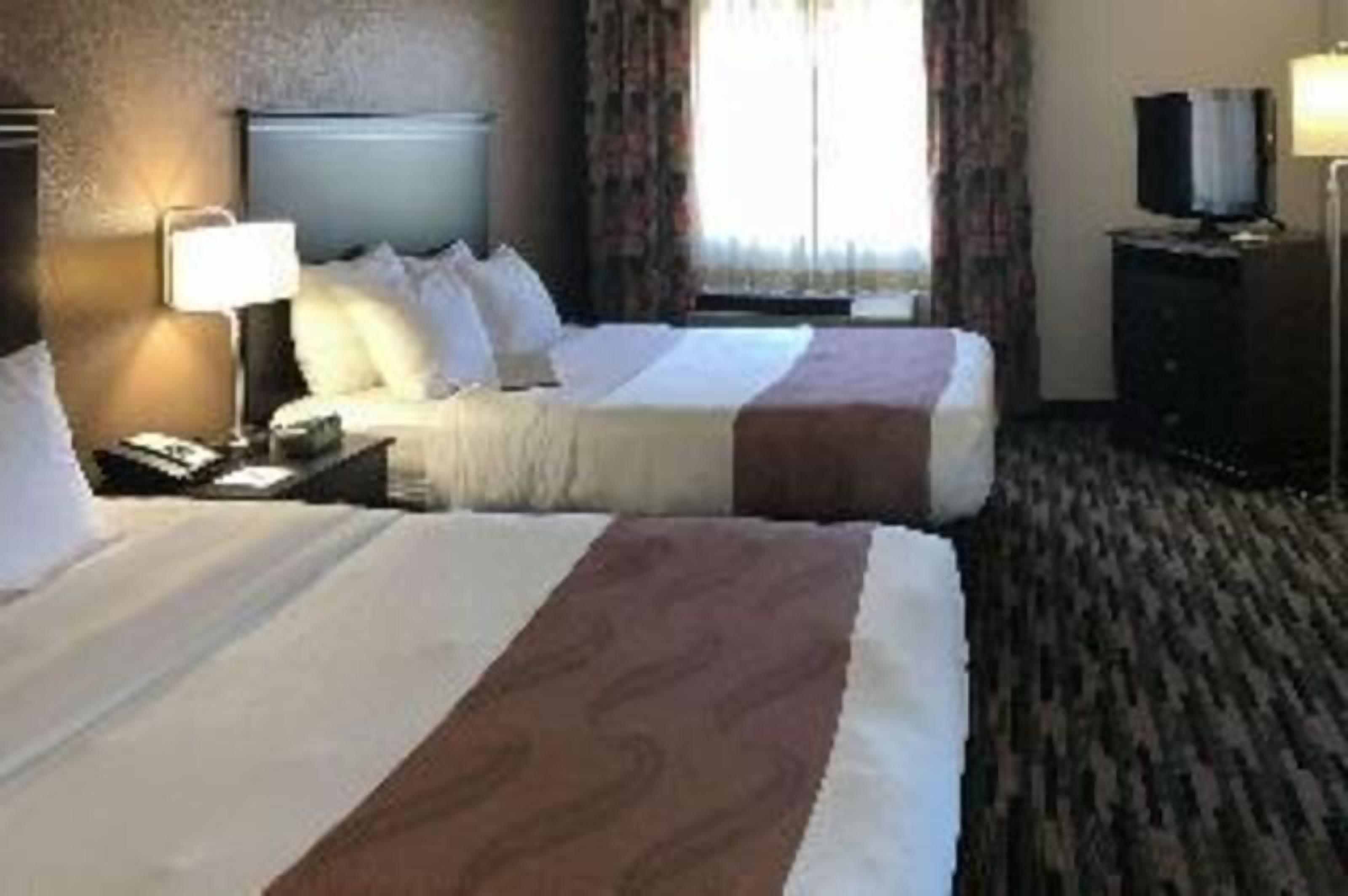 Pillowtop beds, desk, laptop workspace, blackout drapes