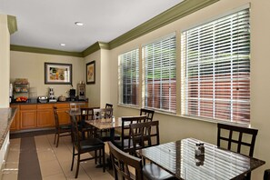 Enjoy meals in this dining area with a large table and comfortable seating for all.