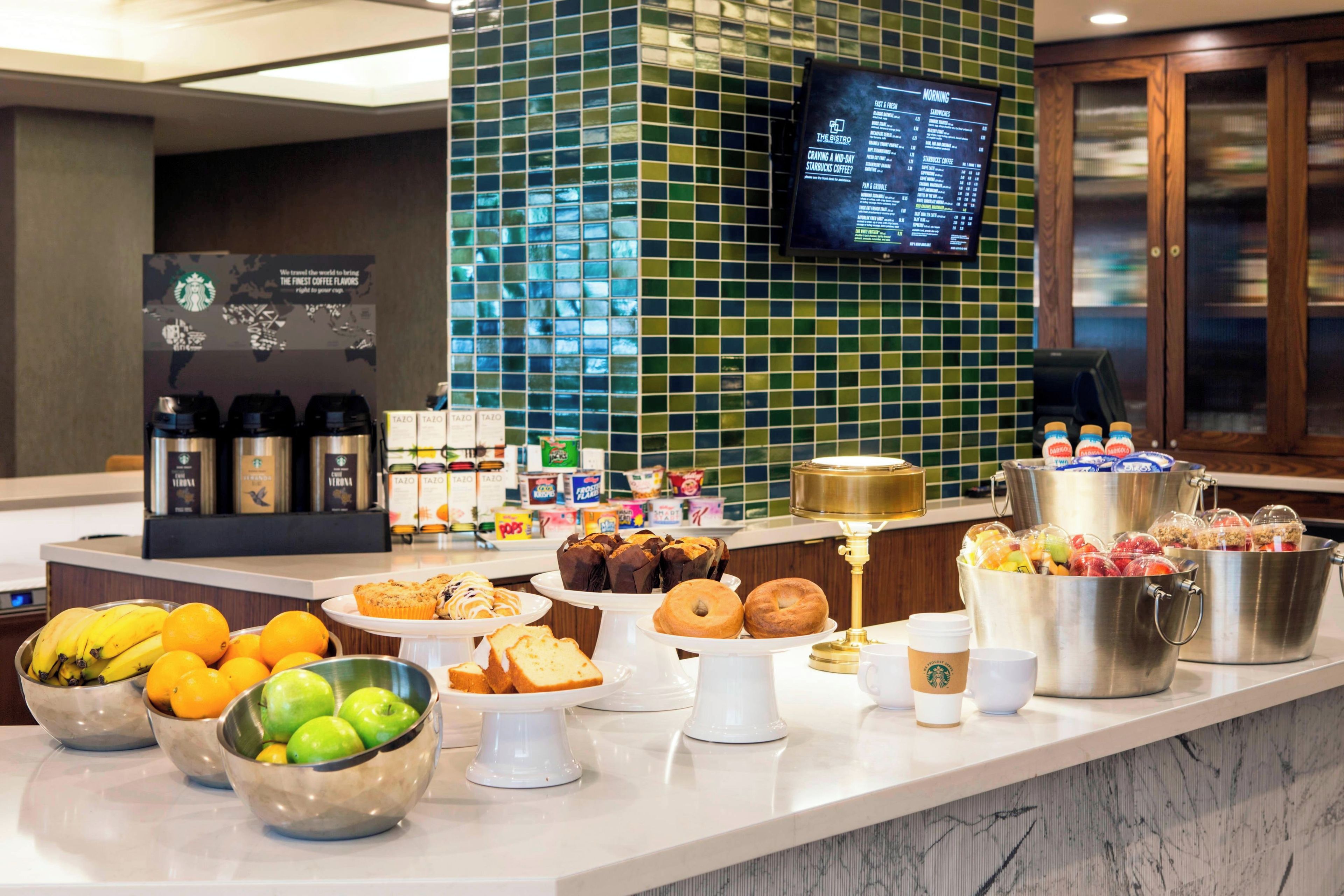 A breakfast buffet with various food items and beverages.