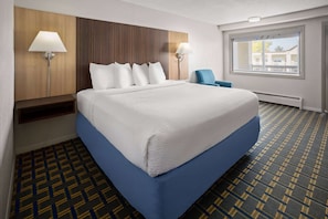 Premium bedding, desk, laptop workspace, blackout curtains