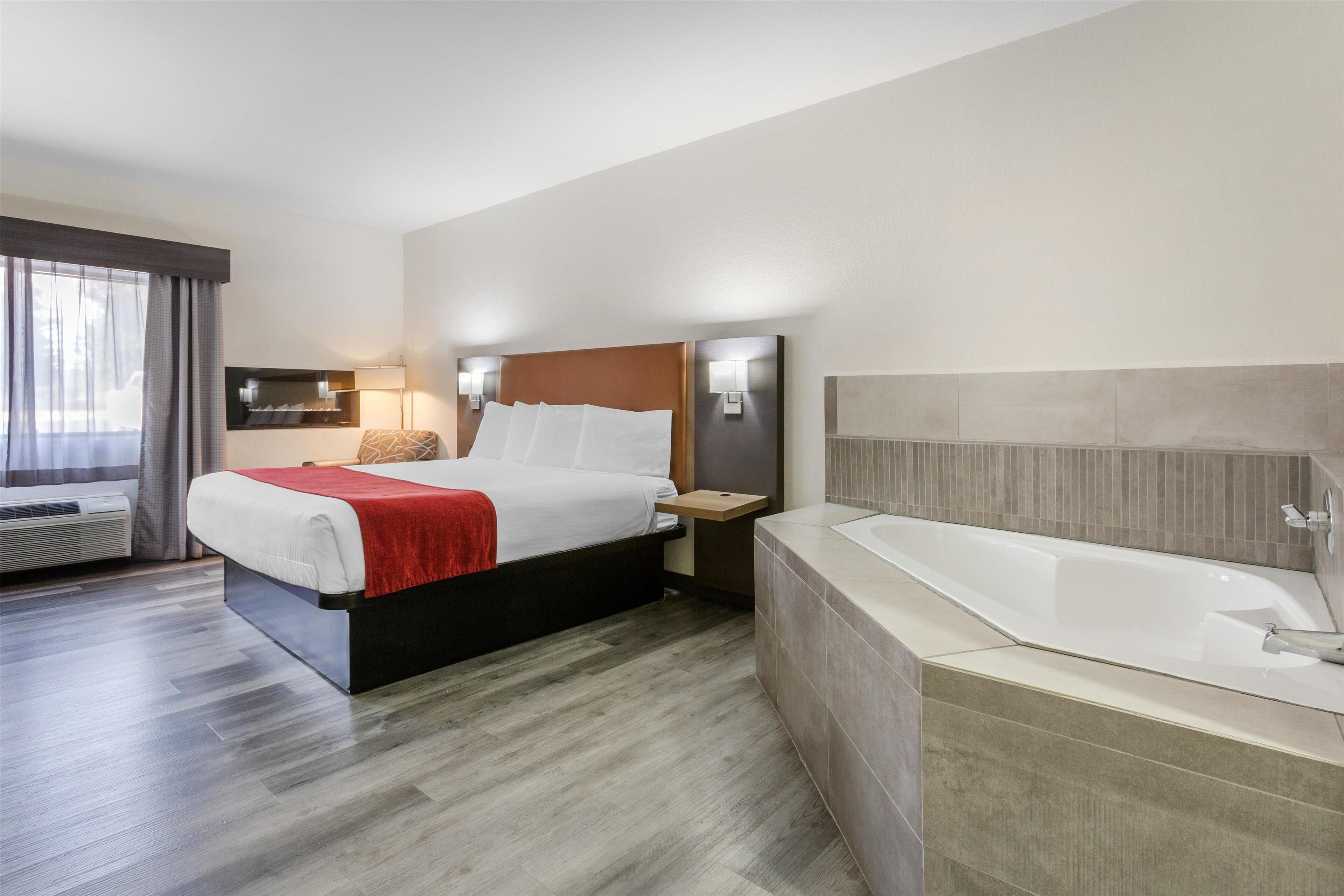 standard room, 1 king bed, non smoking, hot tub | desk, laptop workspace, blackout curtains, iron/ironing board