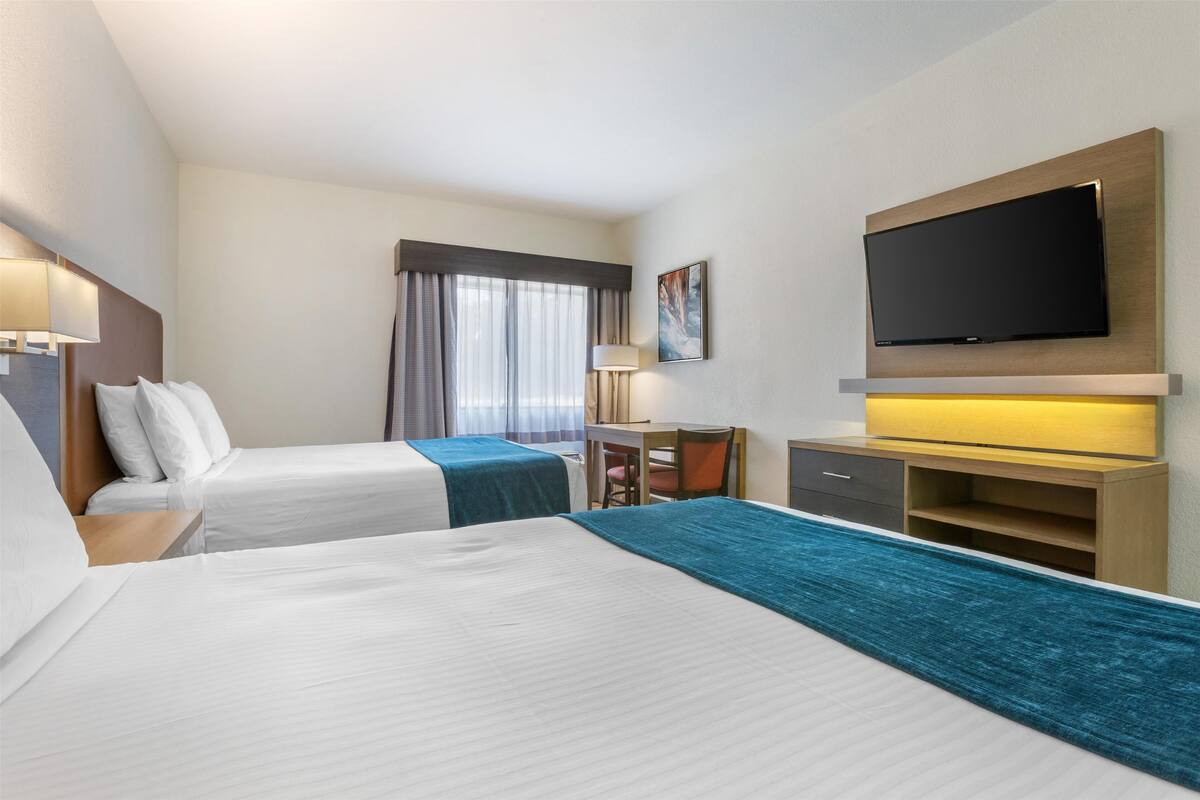 standard room, 2 queen beds, accessible, refrigerator & microwave | desk, laptop workspace, blackout curtains, iron/ironing board