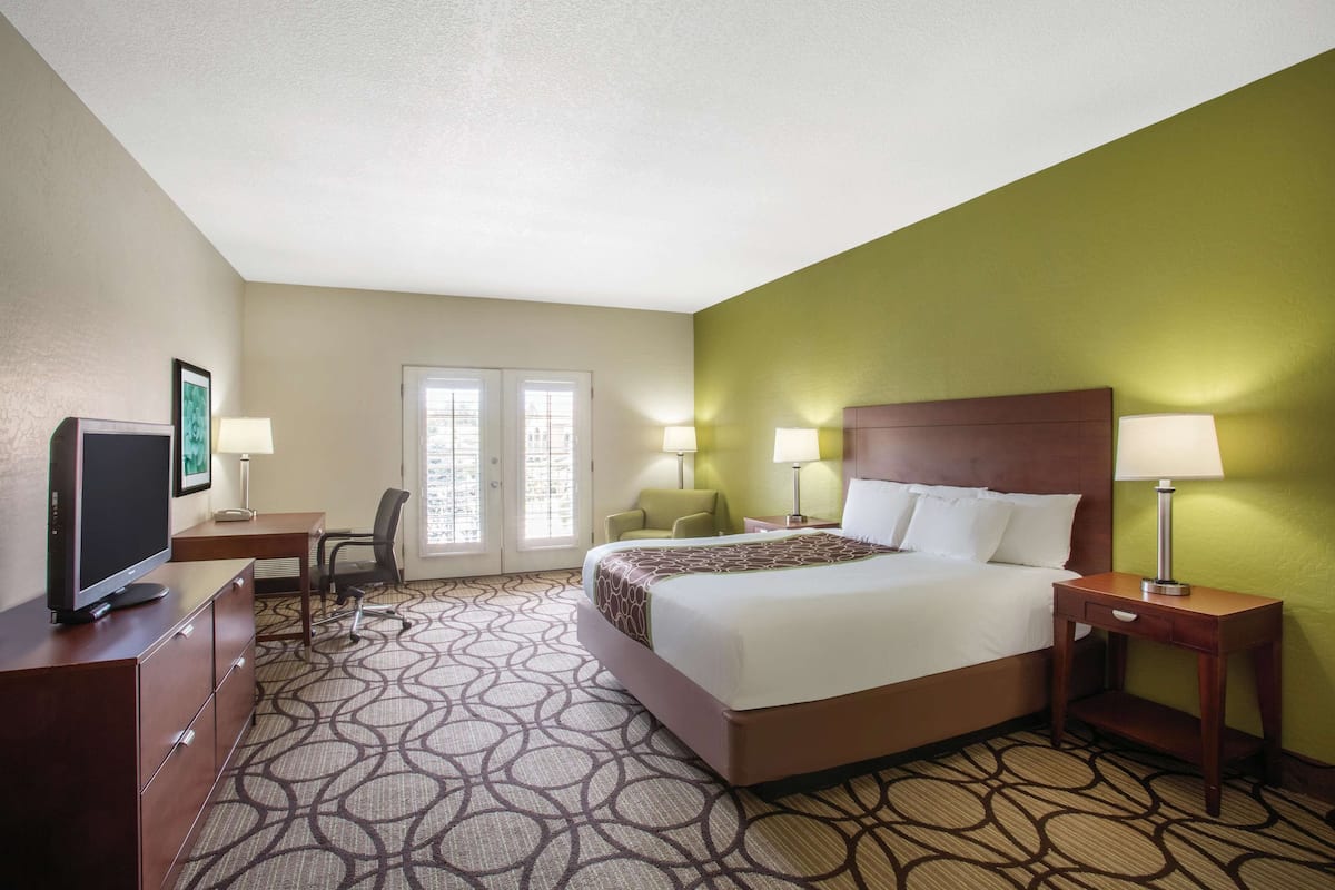 Premium bedding, desk, laptop workspace, iron/ironing board
