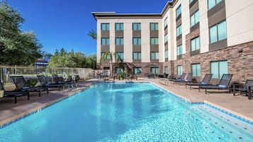 Outdoor pool, a heated pool, pool loungers