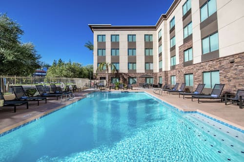 Outdoor pool, a heated pool, pool loungers