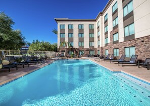 Outdoor pool, a heated pool, sun loungers