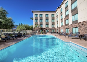 Outdoor pool, a heated pool, pool loungers