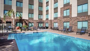 Outdoor pool, a heated pool, sun loungers