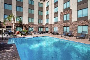 Outdoor pool, a heated pool, sun loungers