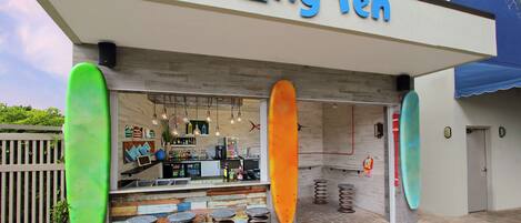 A bar named "Hling Ten" with surfboard decorations and a bar counter.