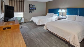 A hotel room with two beds, a desk with a computer, a chair, and a window with blinds. - Hampton Inn Orlando-Maingate South (Davenport)