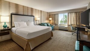 A hotel room with a large bed, a desk, a chair, a TV, and a window with curtains. - Hampton Inn Ft. Lauderdale-West/Pembroke Pines (Pembroke Pines)