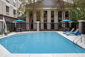 Outdoor pool, open 6:00 AM to 11:00 PM, pool loungers