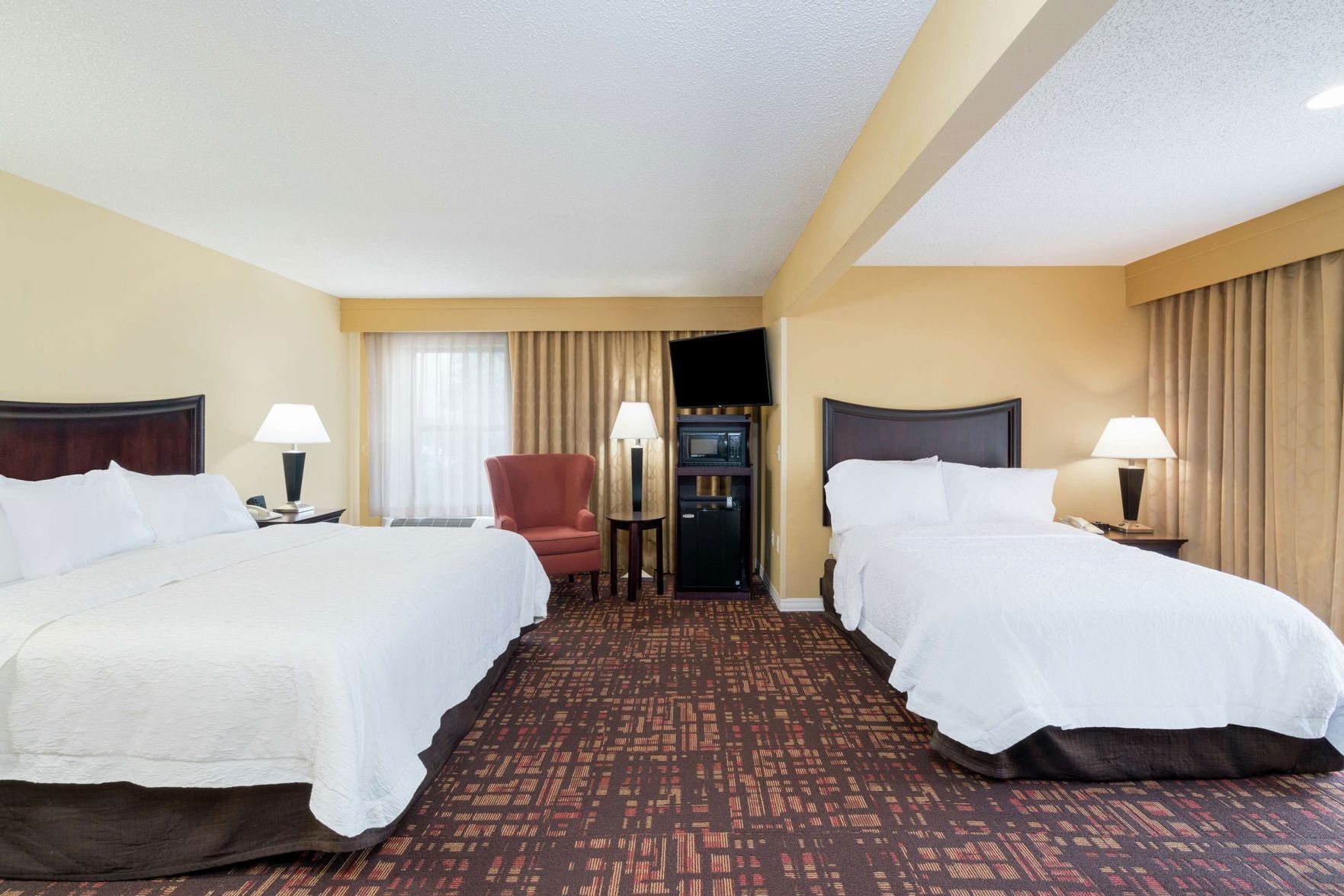 Premium bedding, pillow-top beds, desk, blackout curtains