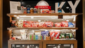 A vending machine stocked with snacks, beverages, and toiletries. - Hampton Inn Somerset (Somerset)