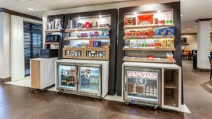 A vending area with microwaves, refrigerators, and snack shelves. - Hampton Inn Boston/Peabody (Peabody)