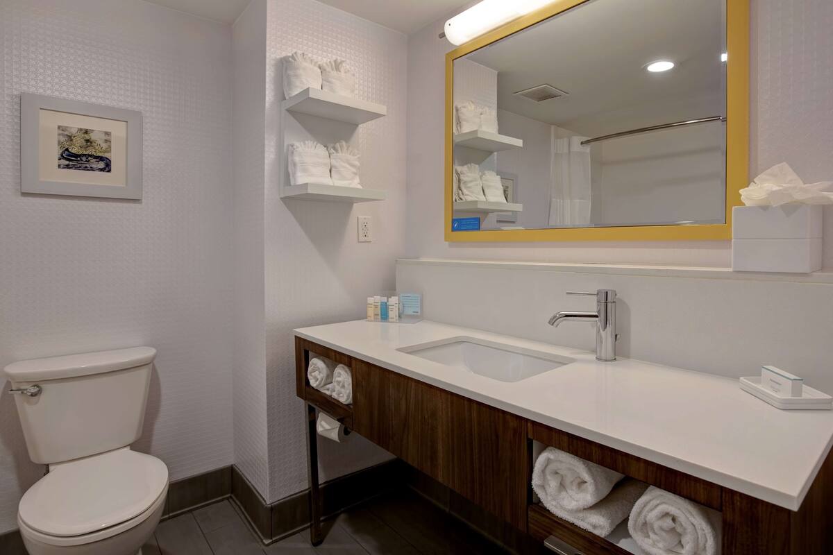 bathtub, hair dryer, towels