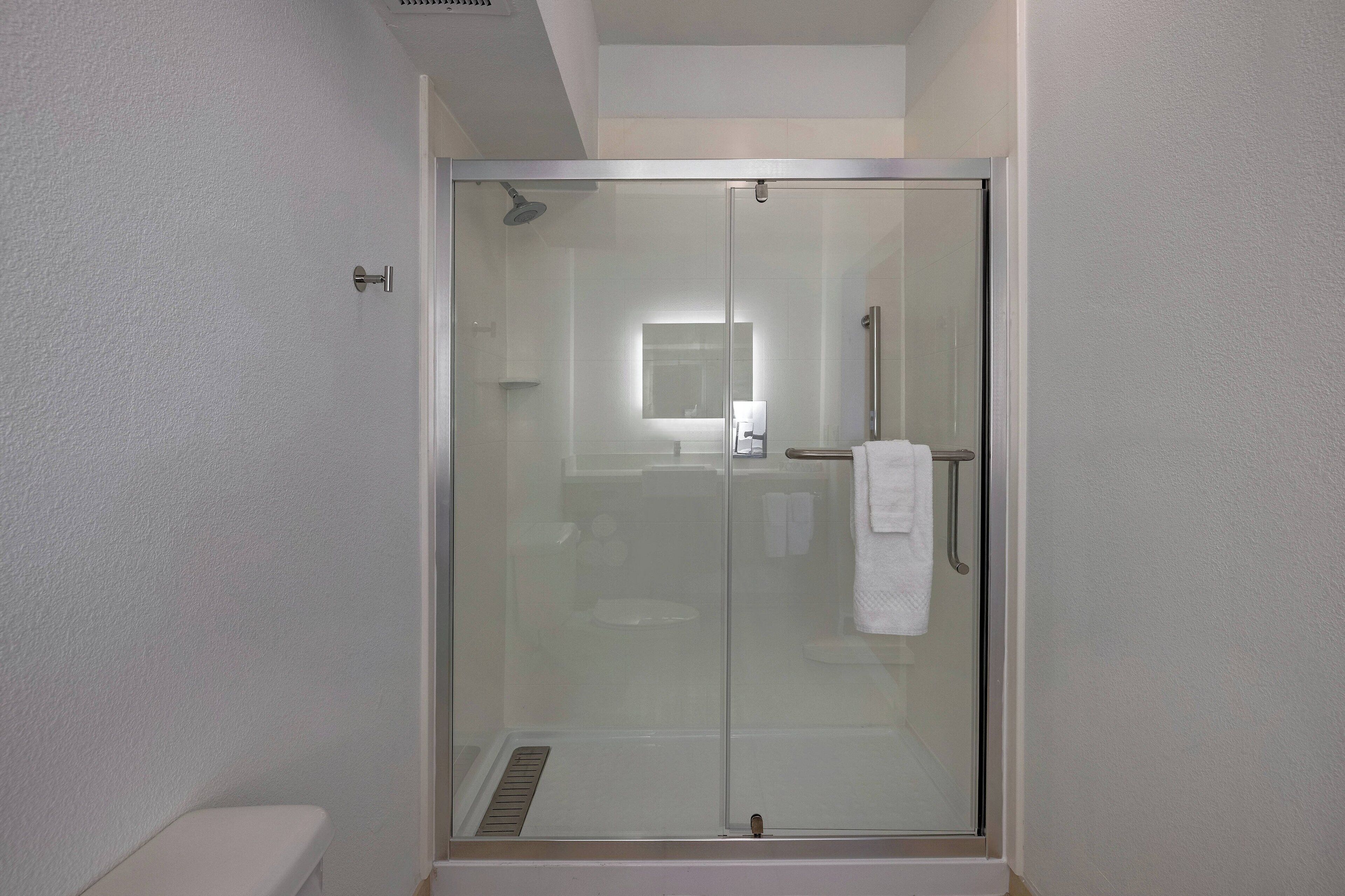 suite, 1 king bed with sofa bed, non smoking | bathroom | combined shower/bathtub, free toiletries, hair dryer, towels