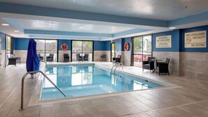 An indoor swimming pool with clear signage, including a lifeguard warning and no diving notice. - Hampton Inn Springfield (Springfield)