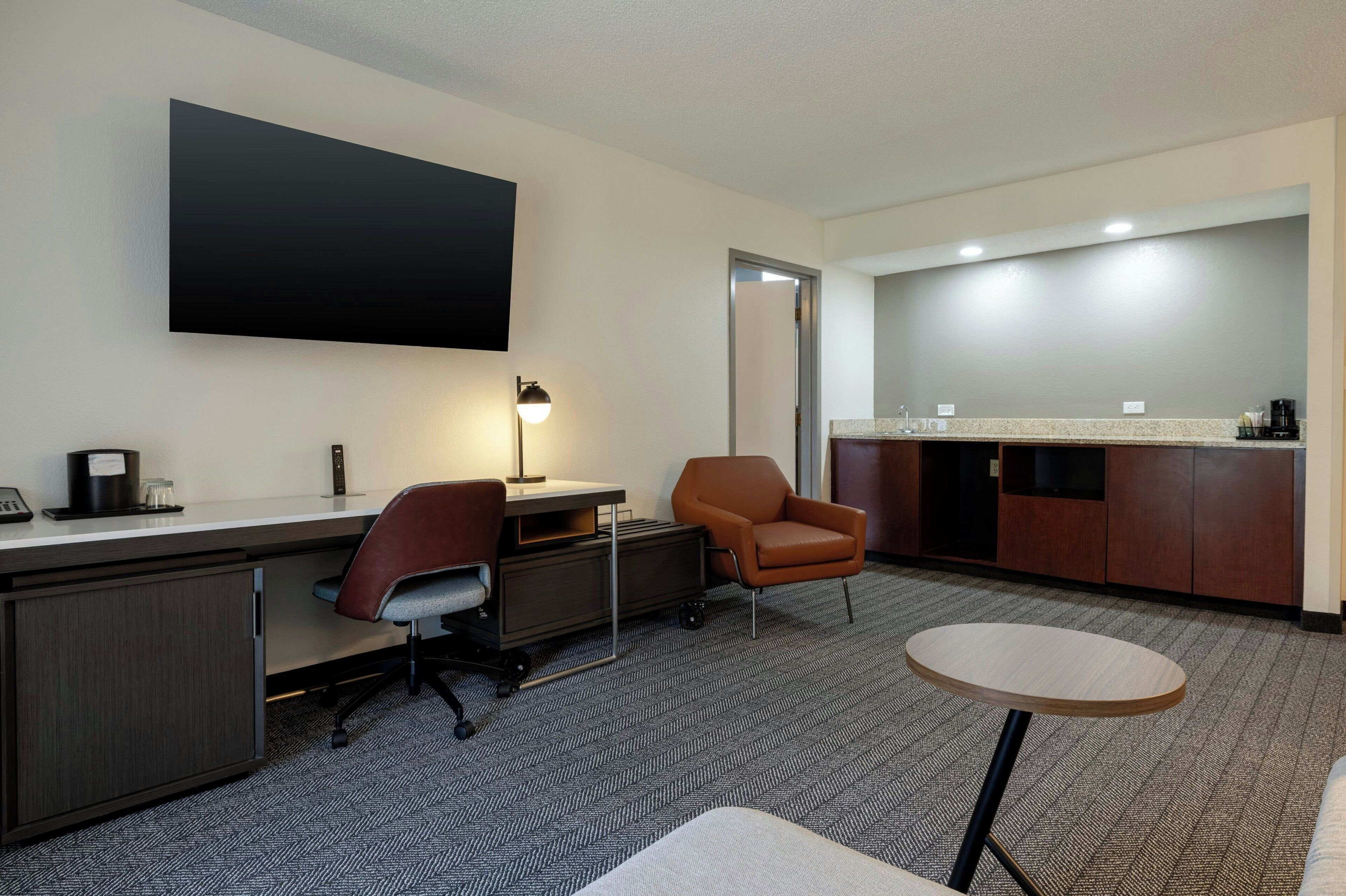 suite, 1 bedroom, courtyard view | living room | 37-inch tv with cable channels, pay films