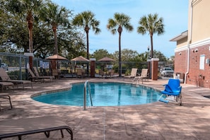 Seasonal outdoor pool, open 10:00 AM to 9:00 PM, pool umbrellas