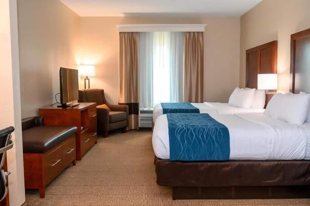 Premium bedding, memory foam beds, desk, laptop workspace