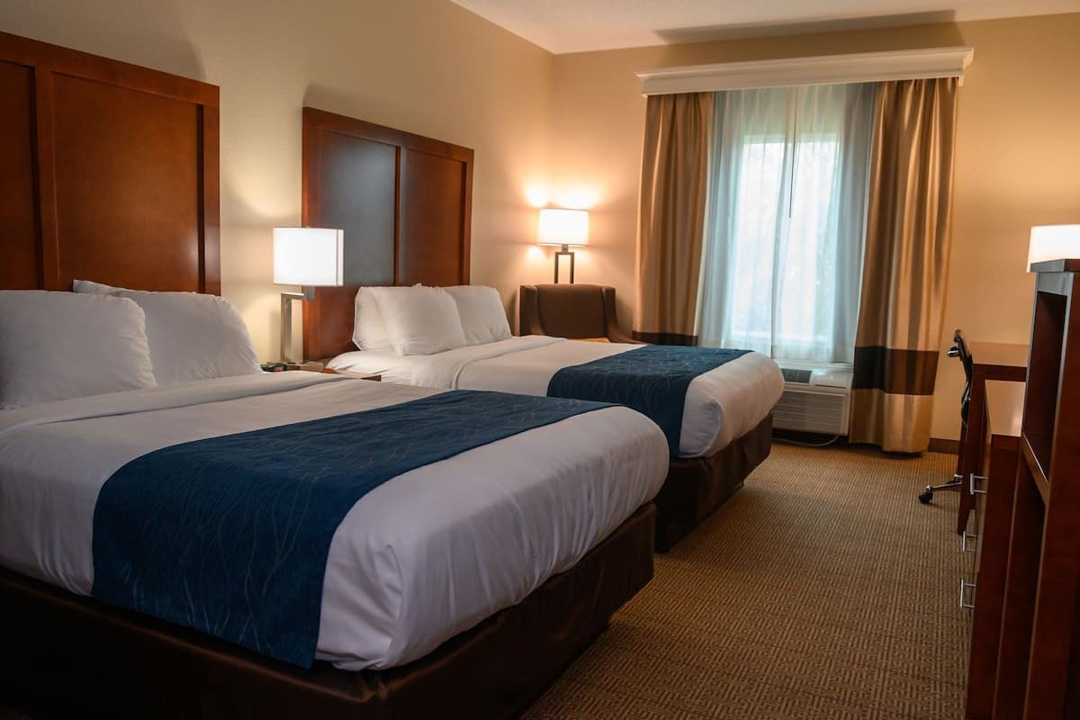 Premium bedding, memory foam beds, desk, laptop workspace