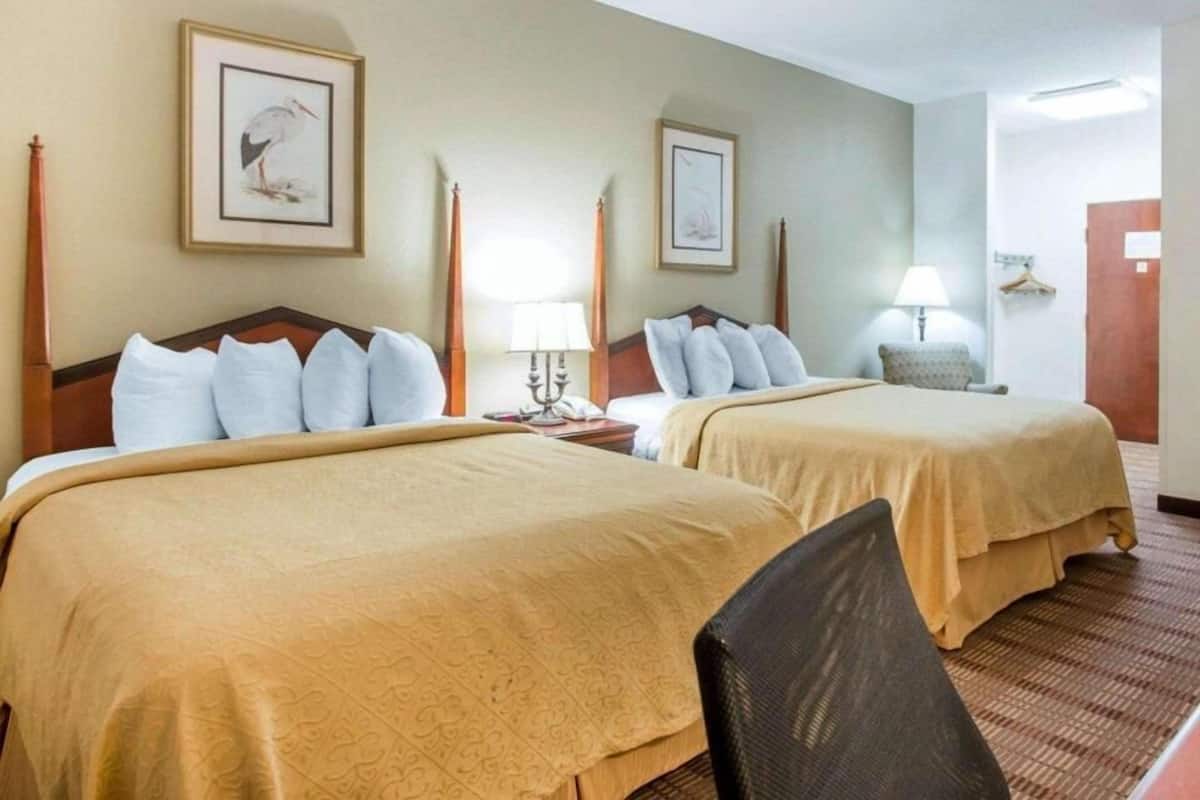 Premium bedding, memory foam beds, desk, laptop workspace