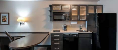 Full-sized fridge, microwave, stovetop, dishwasher