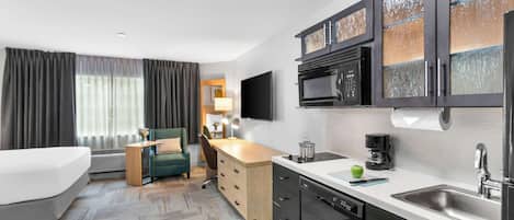Studio, 1 King Bed | Private kitchenette | Full-sized fridge, microwave, coffee/tea maker, cookware/dishes/utensils