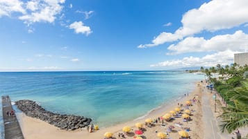 On the beach, sun-loungers, beach umbrellas